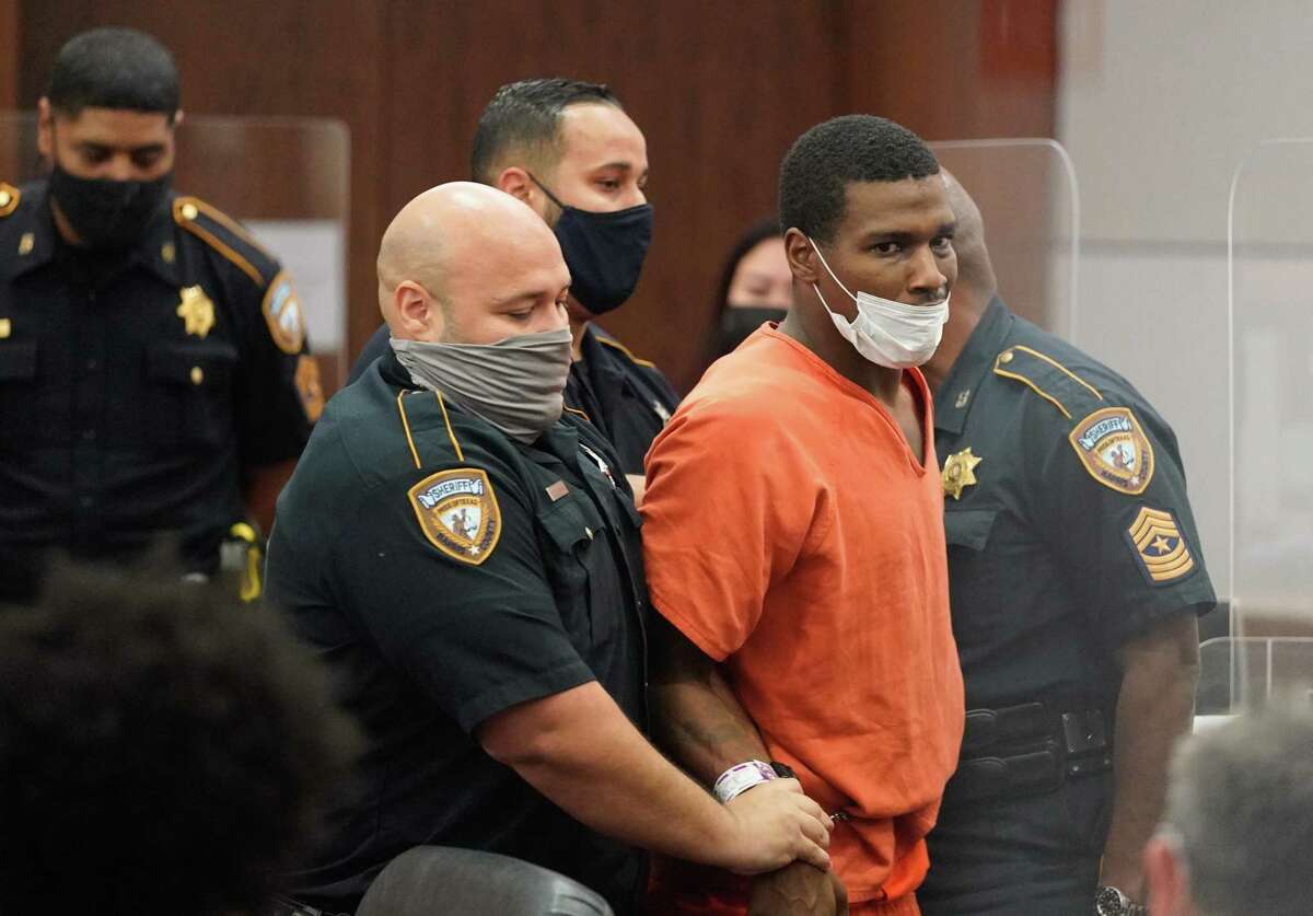 Zacchaeus Rashad Gaston struggles with deputies during an appearance in the Harris County 351st District Court Friday, July 16, 2021 charged in the July 1 death of Layla Steele, 24, while out on seven bonds in Harris County.