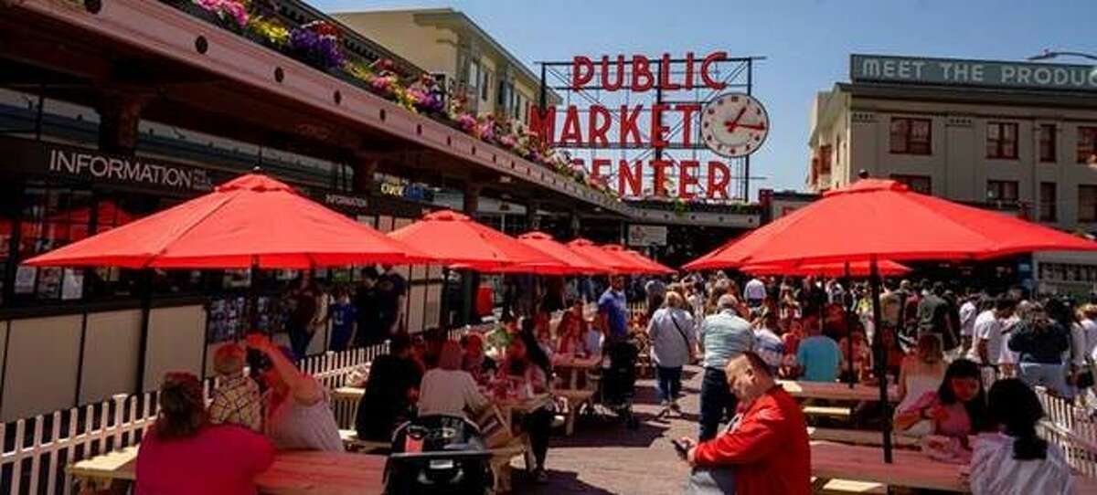 New outdoor seating at Pike Place Market features picnic tables with umbrellas.