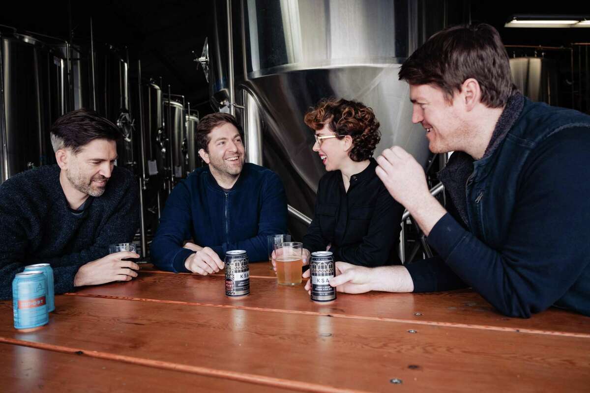 The original Fort Point Brewery team from left to right, Cofounders Tyler and Justin Catalana, creative director Dina Dobkin and Director of brewing Mike Schnebeck and chat over a few beers at the Fort Point Brewery in San Francisco, Calif. on Sunday, January 26, 2020.