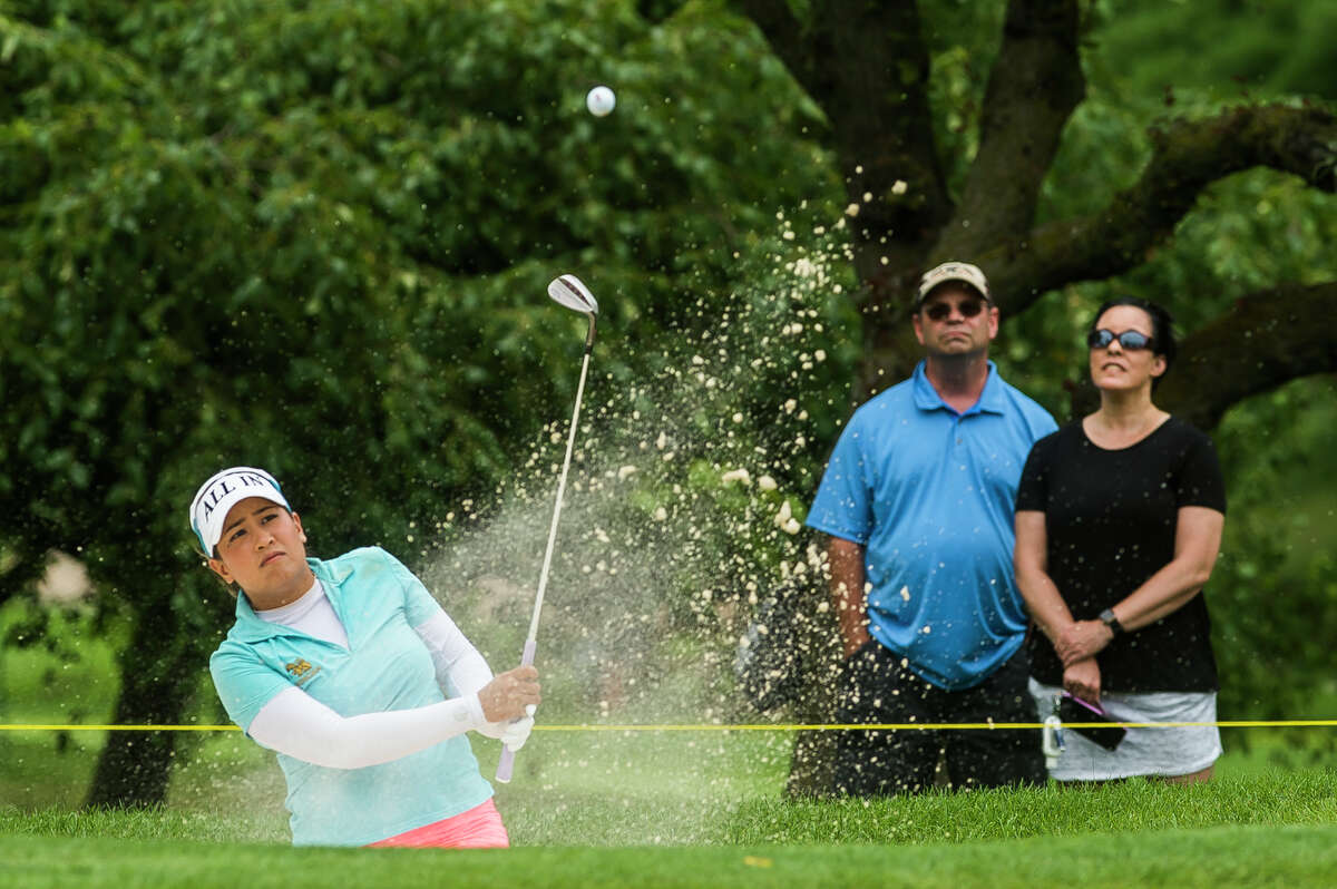 LPGA player Jasmine Suwannapura chips out of a bunker while competing in the third round of play during the Dow Great Lakes Bay Invitational Friday, July 16, 2021 at the Midland Country Club. (Katy Kildee/kkildee@mdn.net)