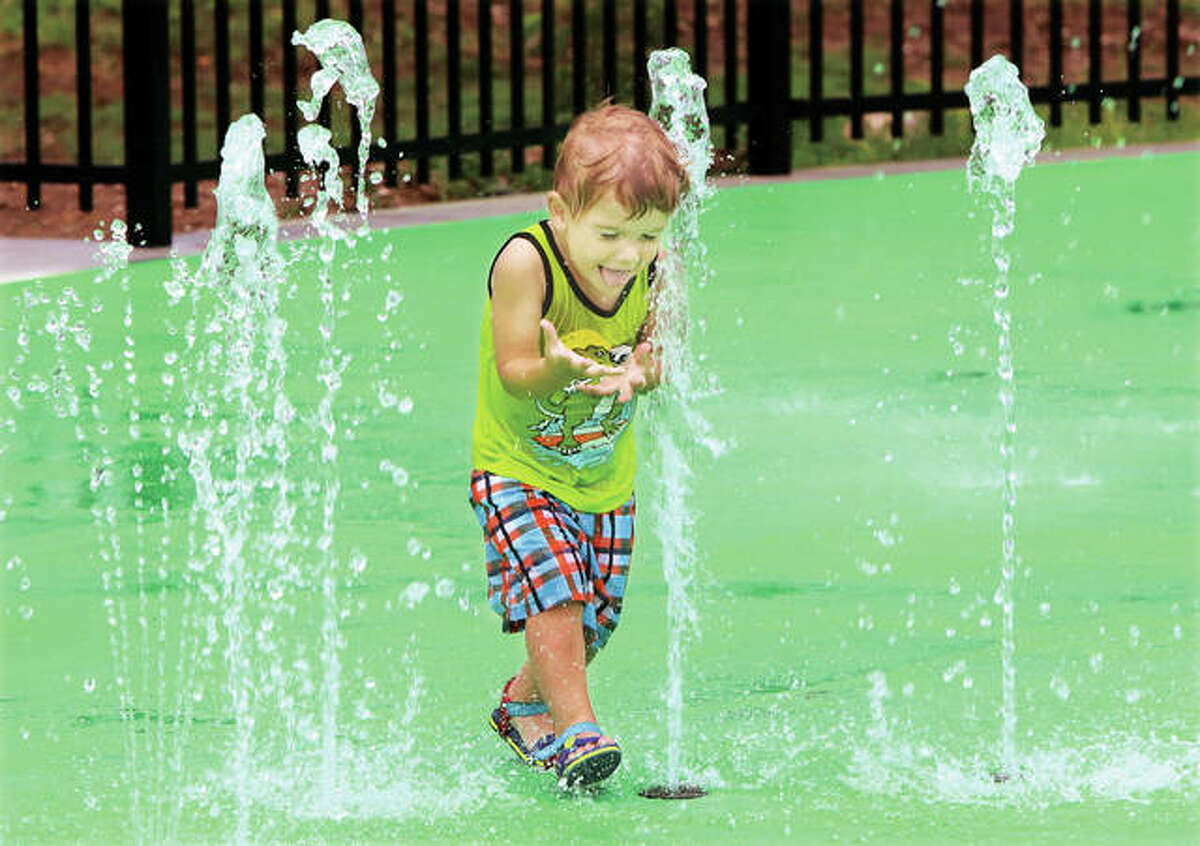 It didn’t take long for the newest feature of Alton’s Riverfront Park to become a big splash Friday. The splash pad was dedicated and its ribbon cut by a group of children on hand to test the new pad for fun. It was a big hit, as demonstrated by Milo Younger, 2, of Alton, who ran through the water with a big smile on his face. The splash pad opens to the public Saturday.