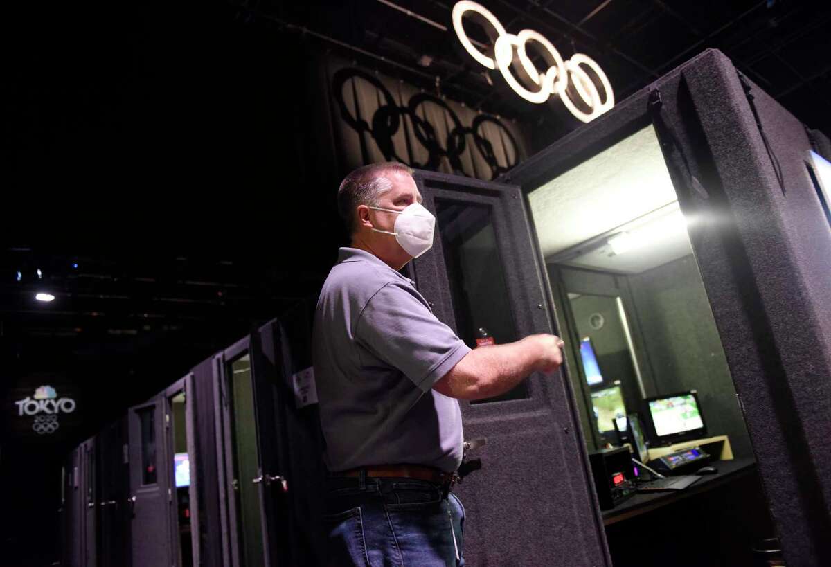 NBC Sports Vice President of Engineering Tim Canary shows the soundproof announcer booths at the NBC Sports headquarters in Stamford, Conn. Tuesday, July 13, 2021. NBC Sports is preparing to cover the Tokyo 2020 Olympic Games, which were postponed a year, in a different way than usual due to the lingering pandemic.