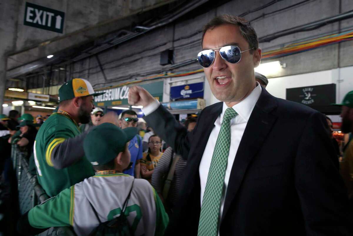 Team president Dave Kaval walks through the stands to greet fans before the Oakland A’s home opener in 2019.