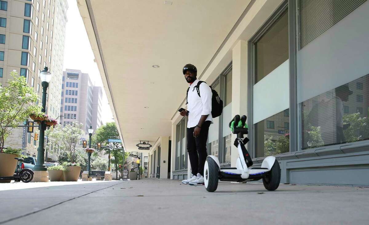 Hoverville founder Terry French uses a self-balancing electric transporter as transportation from his office at Geekdom along Houston Street on Wednesday, July 14, 2021. Some people in the local technology industry are leading a grass roots effort to close Houston Street to motor vehicles. The proposal to shut off motor vehicle traffic along Houston street in the downtown area has recently been brought up on social media.