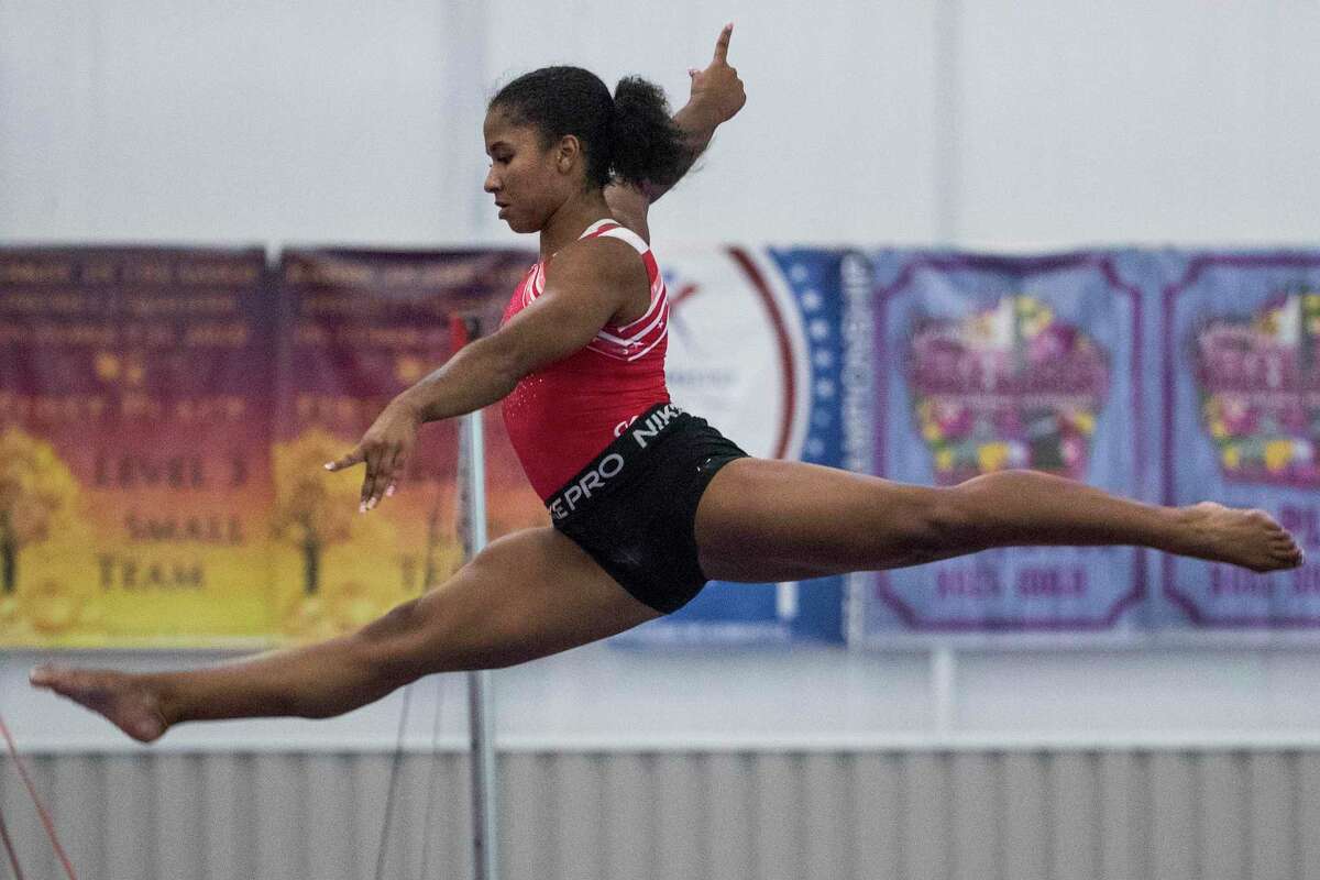 Olympic gymnast Jordan Chiles works on the balance beam as she prepares for the upcoming Tokyo Olympics at World Champions Centre Tuesday, July 6, 2021 in Spring.