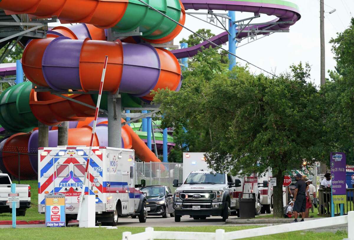 Emergency personnel are shown on scene where people are being treated after chemical leak at Six Flags Hurricane Harbor Splashtown Saturday, July 17, 2021 in Spring.