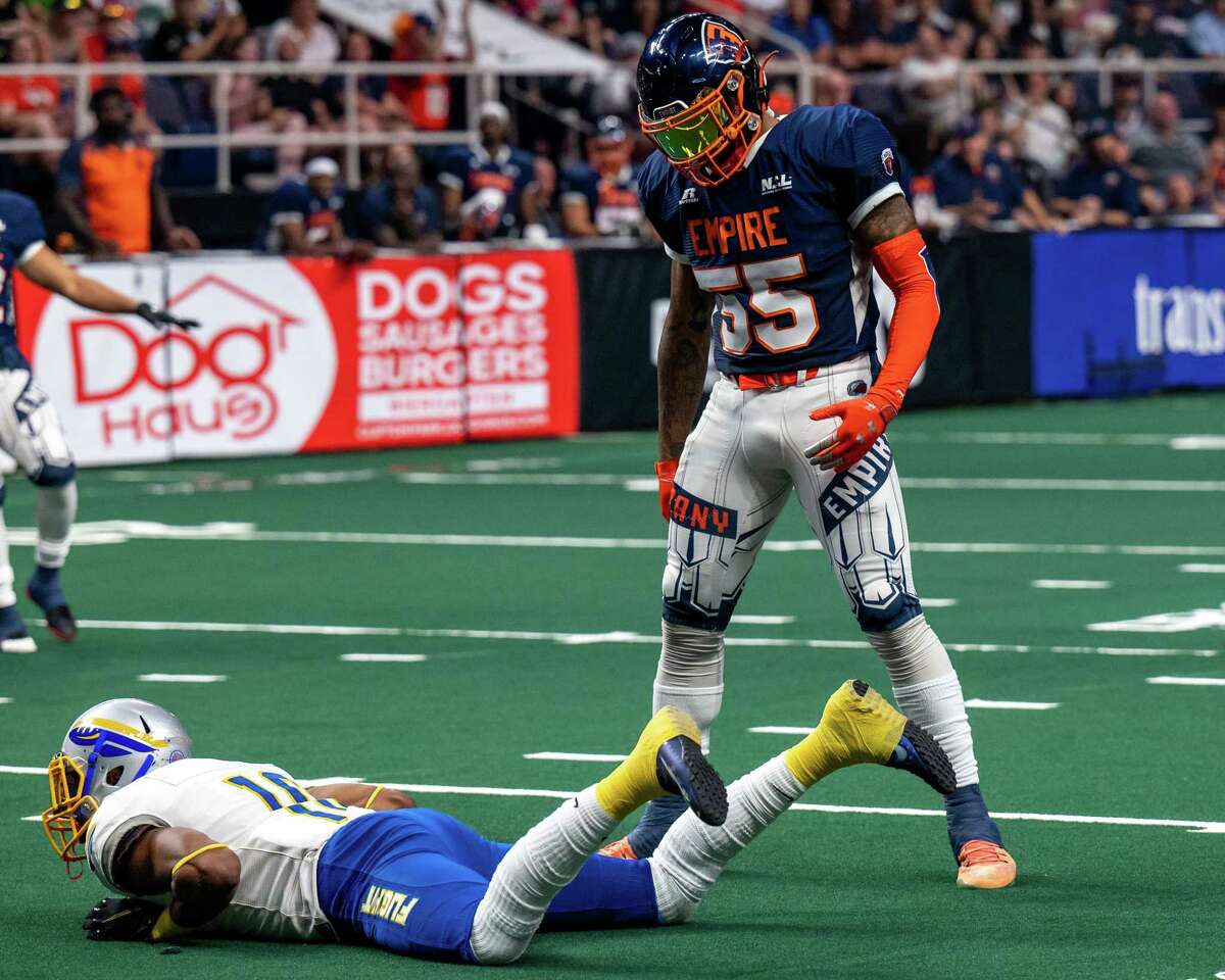 Albany Empire linebacker Trevon Shorts stares at a downed Jersey Flight receiver, Jared Dangerfield, during a game on July 17, 2021. Now Shorts is out for the season with torn thumb ligaments.