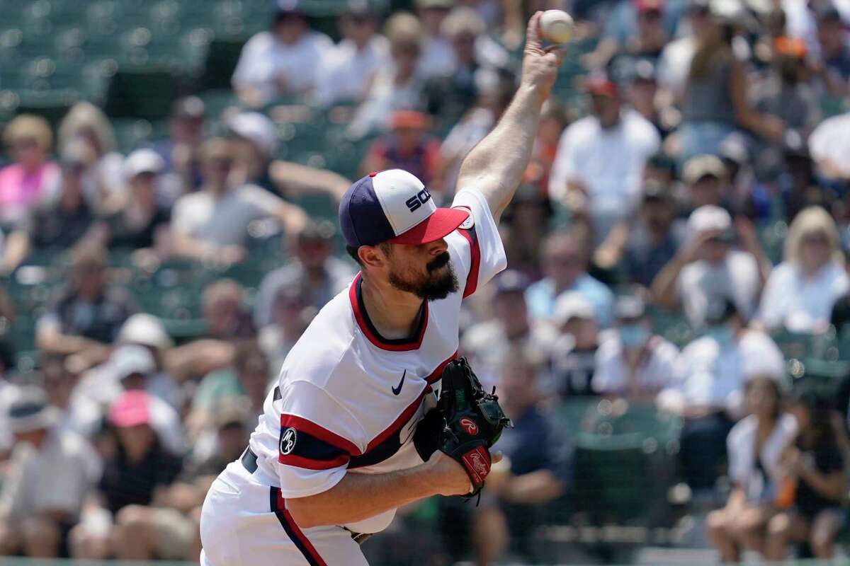 Chicago White Sox starting pitcher Carlos Rodon throws against the Houston Astros during the first inning of a baseball game in Chicago, Sunday, July 18, 2021. (AP Photo/Nam Y. Huh)