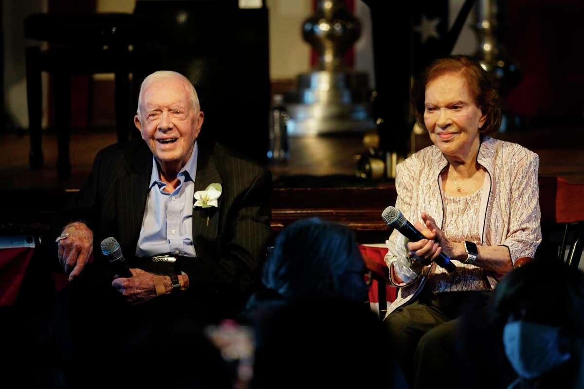 Former President Jimmy Carter and his wife, former First Lady Rosalynn Carter, sit together during a reception to celebrate their 75th anniversary July 10, 2021, in Plains, Ga.
