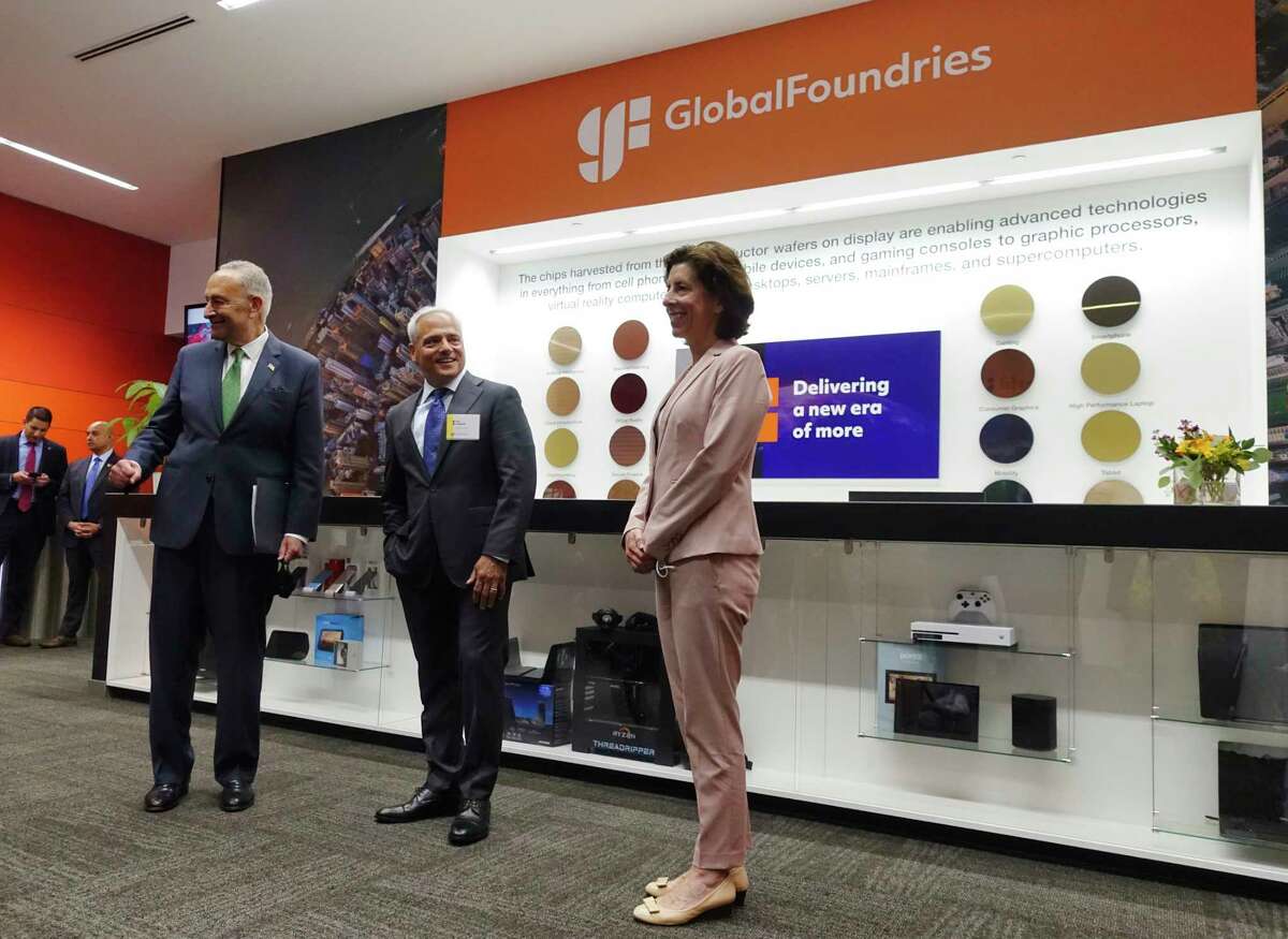 Senate Majority Leader Charles E. Schumer, left, Globalfoundries CEO Tom Caulfield, center, and U.S. Commerce Secretary Gina Raimondo, visit Globalfoundries on Monday, July 19, 2021, in Malta, N.Y. Caulfield announced at the event that a second chip plant would be built in Malta, but those plans are on hold. (Paul Buckowski/Times Union)