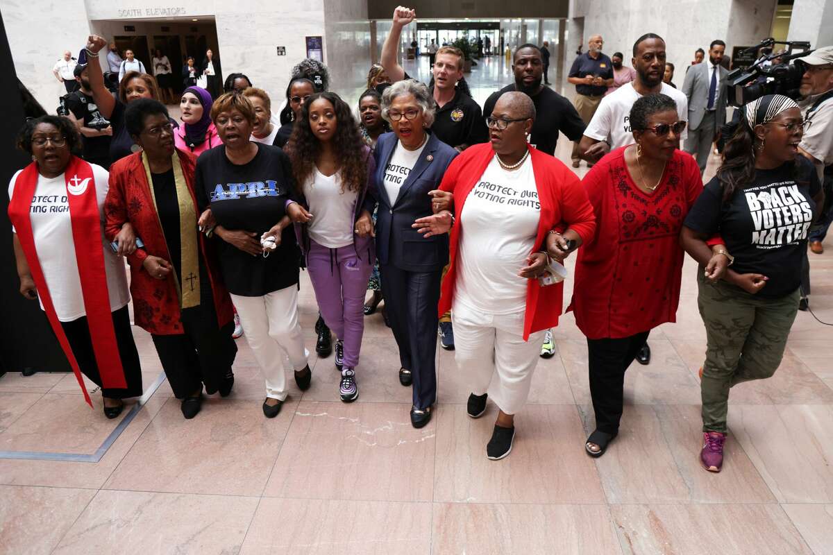 U.S. Rep. Joyce Beatty, D-Ohio, center, was one of nine arrested last week during a protest on U.S. Capitol Grounds advocating for voting rights. Kimiya Factory, a 22-year-old San Antonio activist, was among those arrested.