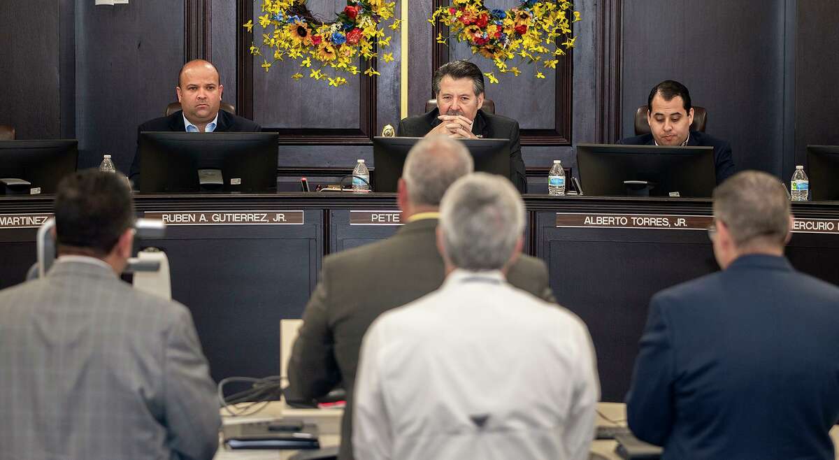 Laredo City Councilmember Ruben Gutierrez Jr., Mayor Pete Saenz and Councilmember Alberto Torres Jr. listen as Utilities Director Arturo Garcia, Assistant Utilities Director Michael Rodgers and TCEQ representatives detail the water treatment plant processes and distribution limits, Monday, July 12, 2021, during a special city council meeting at City Hall.