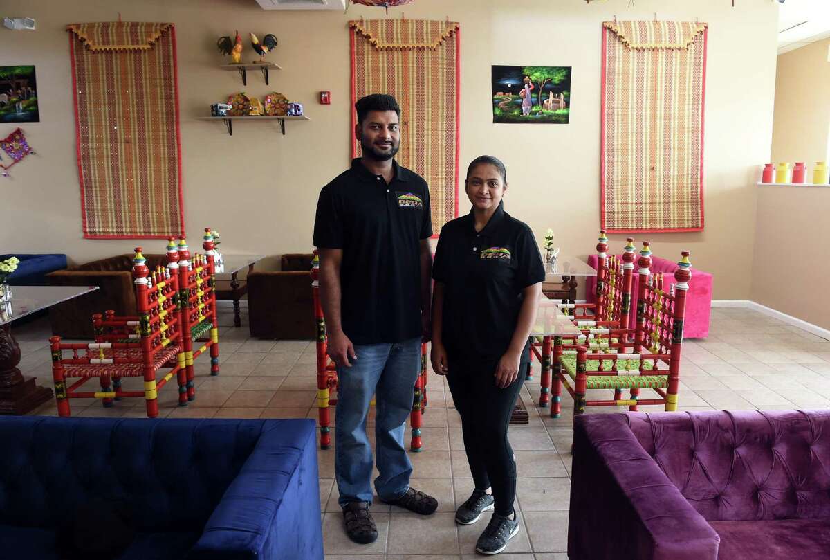 Muhammad Haroon and his wife, Neelem, are photographed at their new restaurant, Dera BBQ, in Orange on July 15, 2021.