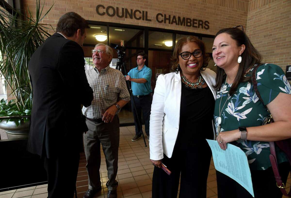 Ava Graves greets Amanda Yarbrough outisde council chambers after a break uponn the decision to table the vote concerning the purchase of the AT&T building during Beaumont's City Council meeting Tuesday. Ultimately, owner TomFlanagan agreed to a proposed extension of the vote as requested by Mayor Becky Ames following passionate discussion on both sides by area residents. Photo made Tuesday, June 15, 2021 Kim Brent/The Enterprise