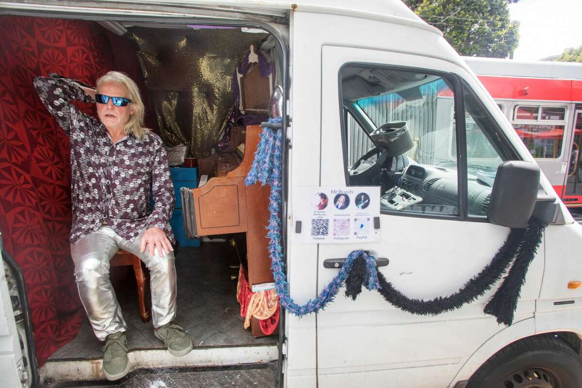 Brandy Collins, whose name is Mr. Brandy, is taking a break from playing the piano in his Sprinter van in the Haight-Ashbury neighborhood of San Francisco on July 16, 2021.  He street music and occasionally makes between $ 15 and $ 100 during a session.