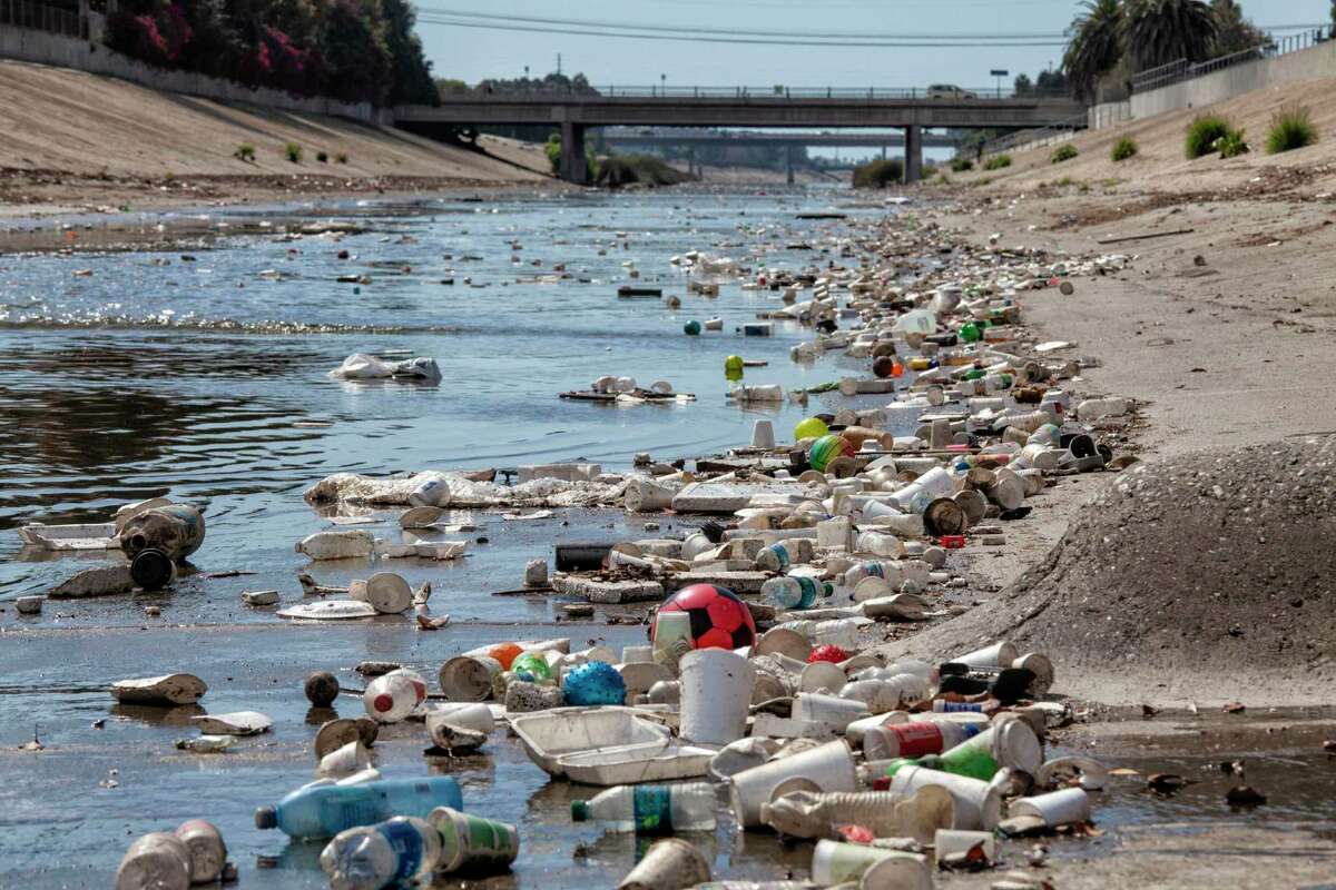 Large amounts of trash and plastic refuse collect in Ballona Creek after a rain storm in Culver City, Calif.