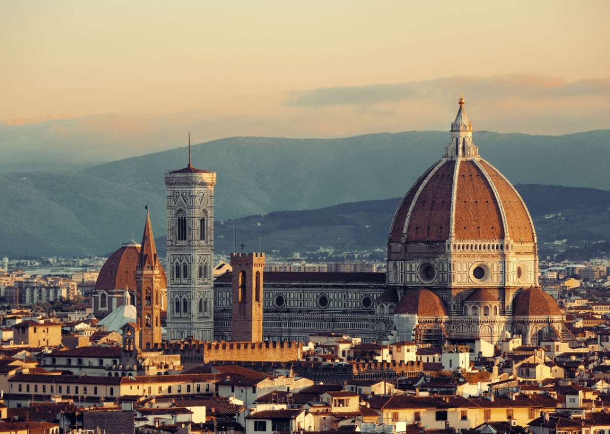 Answer: Florence, Italy The skyline of Florence is most recognizable for its red terracotta roof tiles and cathedral including the famous Il Duomo. Construction of the stunning edifice created by the architect Filippo Brunelleschi began in 1420 and was completed in 1436.