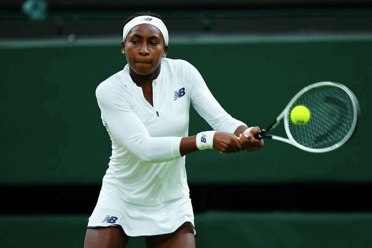In this photo from July 6, 2021, Coco Gauff of The United States, playing partner of Caty McNally of The United States plays a backhand in their Ladies' Doubles Third Round match against Veronika Kudermetova and Elena Vesnina of Russia during Day Eight of The Championships - Wimbledon 2021 at All England Lawn Tennis and Croquet Club in London, England. Gauff will not be playing in the Olympics after testing positive for COVID-19. (Mike Hewitt/Getty Images/TNS)
