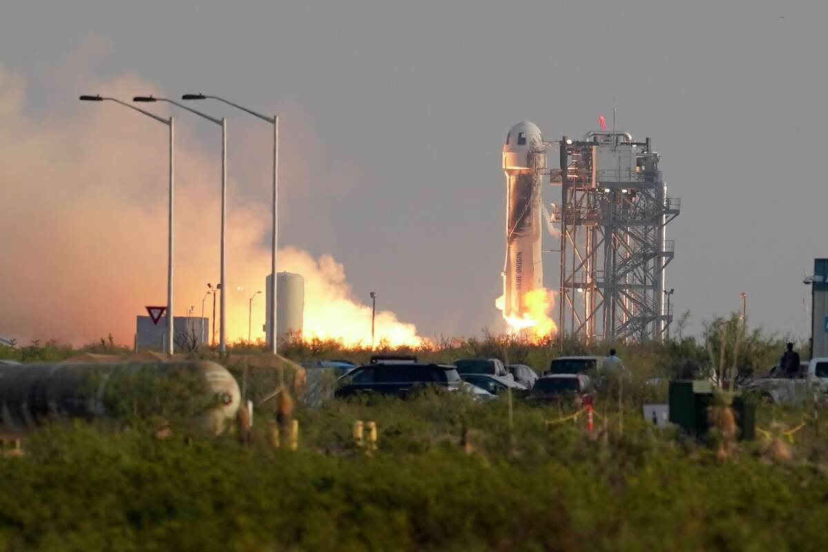 Blue Origin's New Shepard rocket launches carrying passengers Jeff Bezos, founder of Amazon and space tourism company Blue Origin, brother Mark Bezos, Oliver Daemen and Wally Funk, from its spaceport near Van Horn, Texas, Tuesday, July 20, 2021.