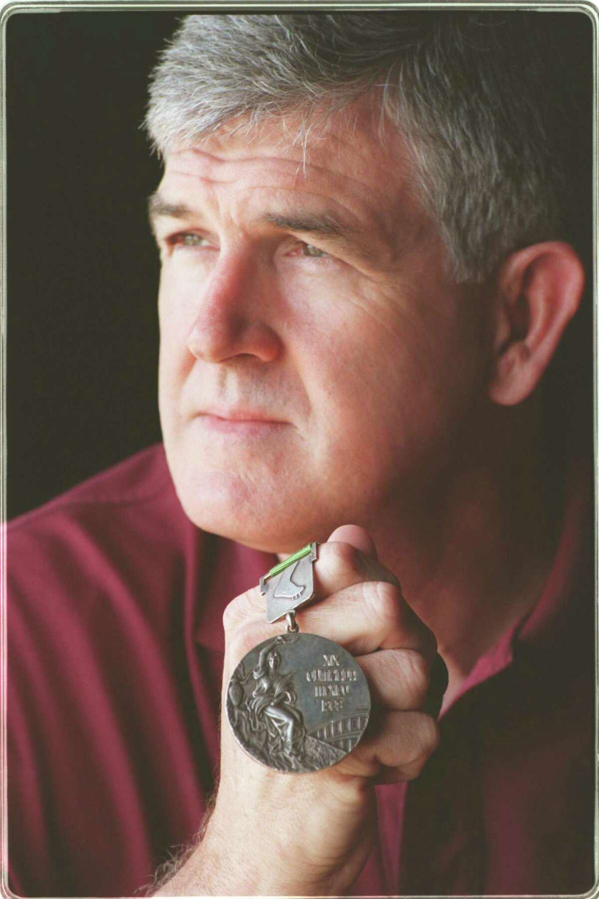 Former Texas A&M shot putter Randy Matson with his gold medal fro Mexico City. He also won silver in Tokyo.
