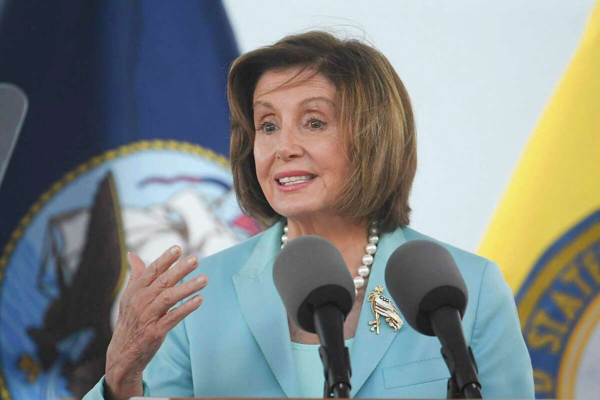 Speaker of the House Nancy Pelosi speaks at a christening ceremony for the the USNS John Lewis in San Diego. A member of Pelosi’s staff tested positive for the coronavirus after meeting with a group of Texas Democrats.