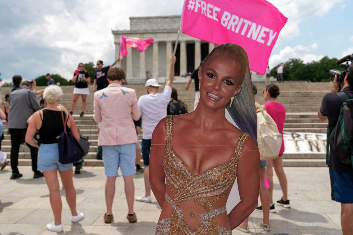 Fans and supporters of pop star Britney Spears protest at the Lincoln Memorial, during the "Free Britney" rally, Wednesday, July 14, 2021, in Washington. Rallies have been taking place across the country since the pop star spoke out against her conservatorship in court last month.