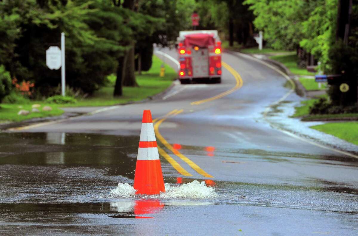 Water bubbles out onto Shore Road in Greenwich after a storm.