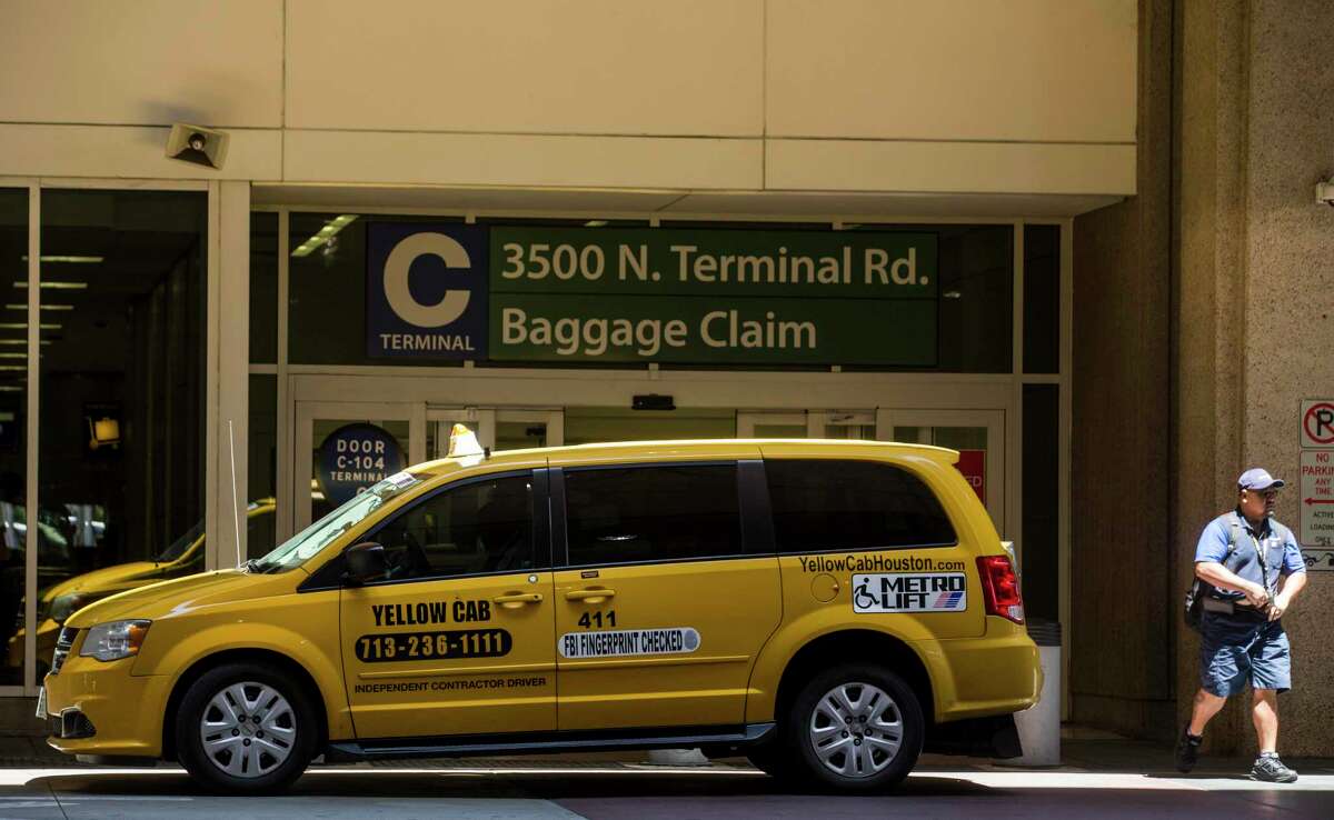 A Yellow Cab taxi waits for fares outside George Bush Intercontinental Airport on May 18, 2020 in Houston. Yellow Cab on July 19 confirmed it was filing for bankruptcy.