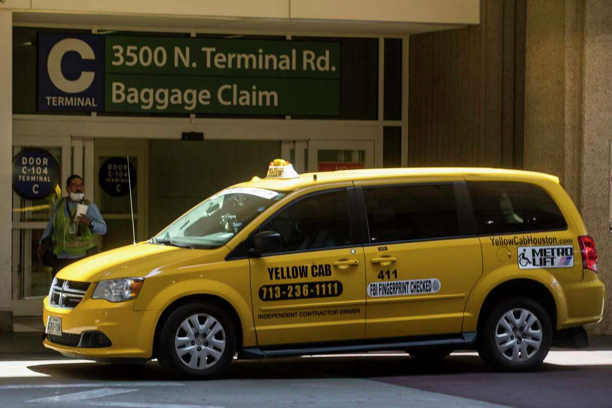 A Yellow Cab taxi waits for fares outside George Bush Intercontinental Airport on May 18, 2020 in Houston. Yellow Cab on July 19 confirmed it was filing for bankruptcy.