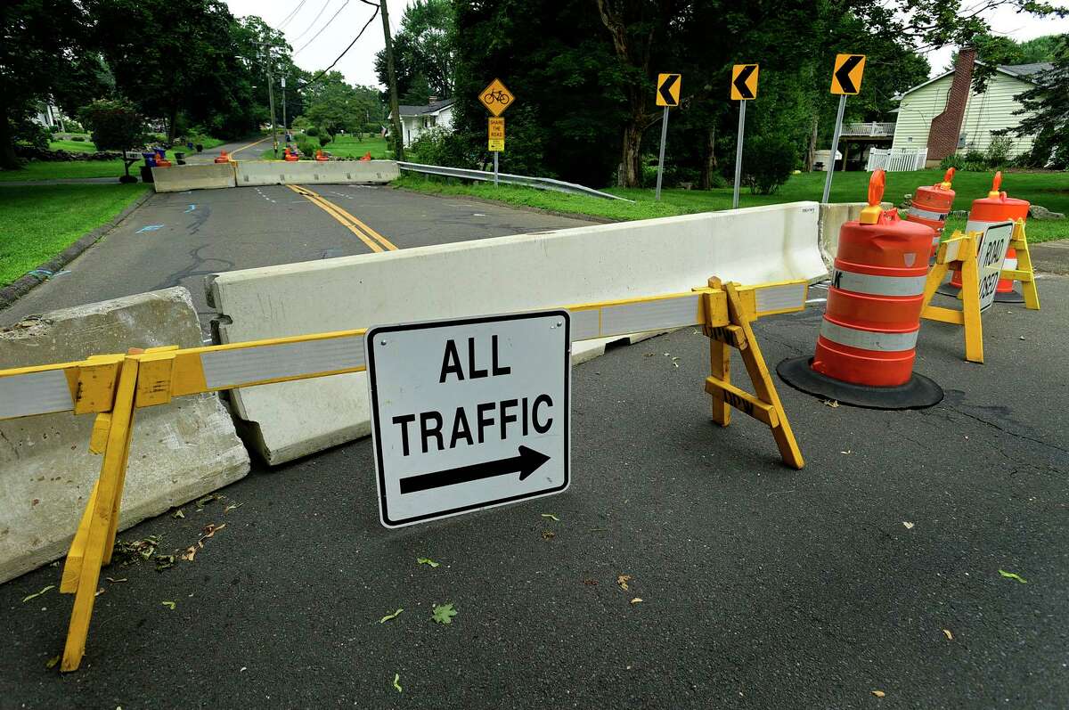 Rowayton Ave is closed at Keelers Brook watercourse bridge Tuesday, July 20, 2021, in Norwalk, Conn. A detour is currently in place at the intersection of Rowayton Avenue and Woodchuck Lane. The road will be closed for three months
