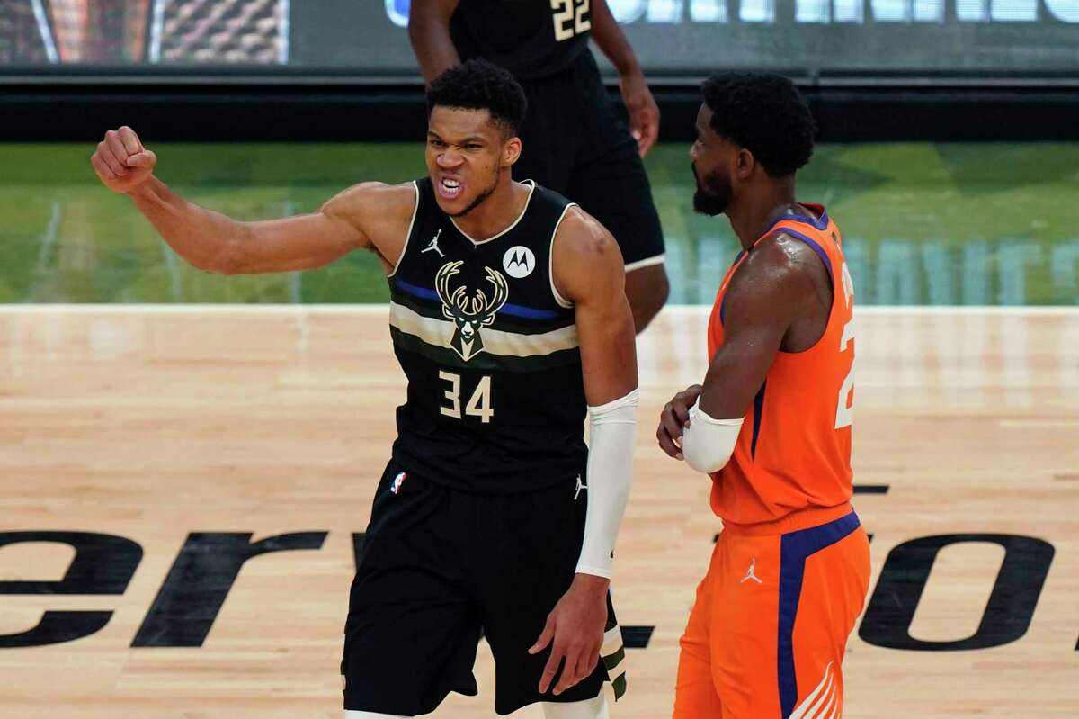 Milwaukee Bucks forward Giannis Antetokounmpo (34) reacts during the second half of Game 6 of basketball's NBA Finals against the Phoenix Suns in Milwaukee, Tuesday, July 20, 2021. (AP Photo/Paul Sancya)