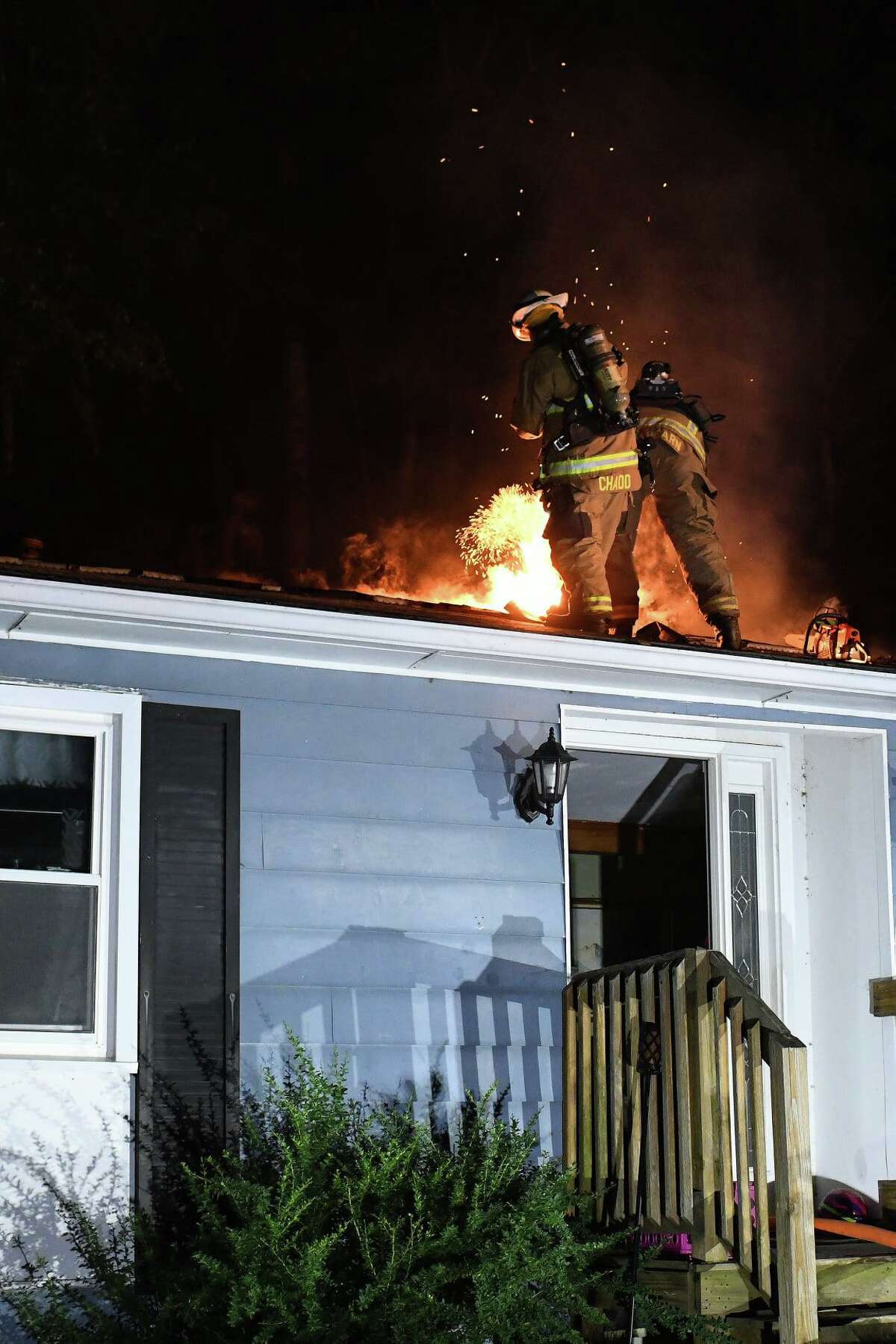 Crews battle a fire at a Chamberlain Hill Road home in Haddam, Conn., on Saturday, July 17, 2021.
