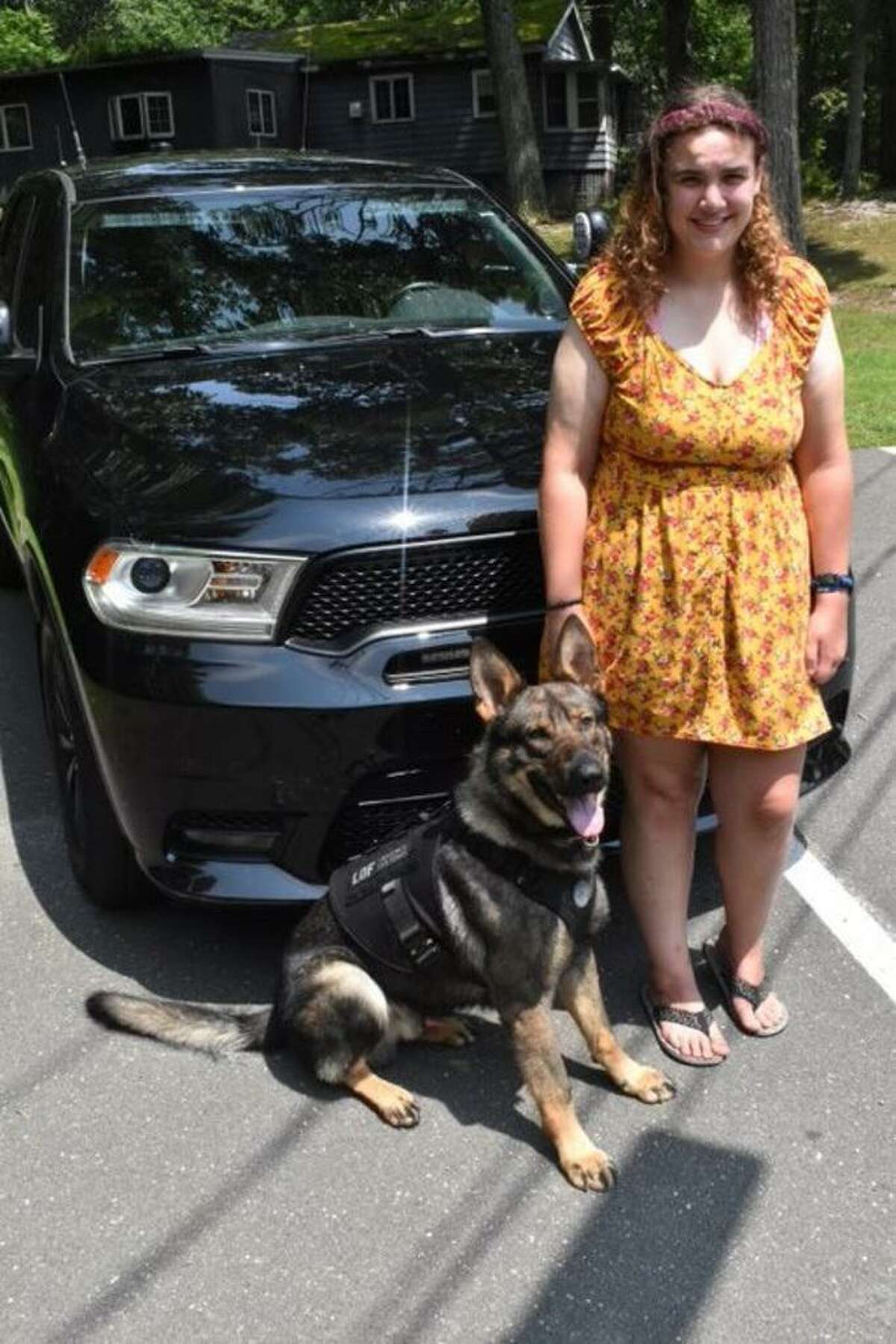 Brittany Murphy of West Haven with Magnus, a Portland police dog she outfitted with a bulletproof vest.