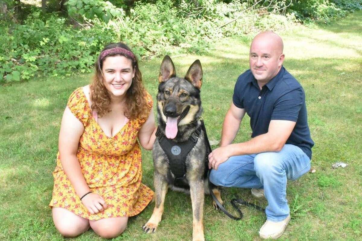 From left to right: Brittany Murphy of West Haven, police K-9 Magnus and Portland Police Sgt. Jim Kelly. Murphy raised $1,200 to donate a bulletproof vest to Magnus.