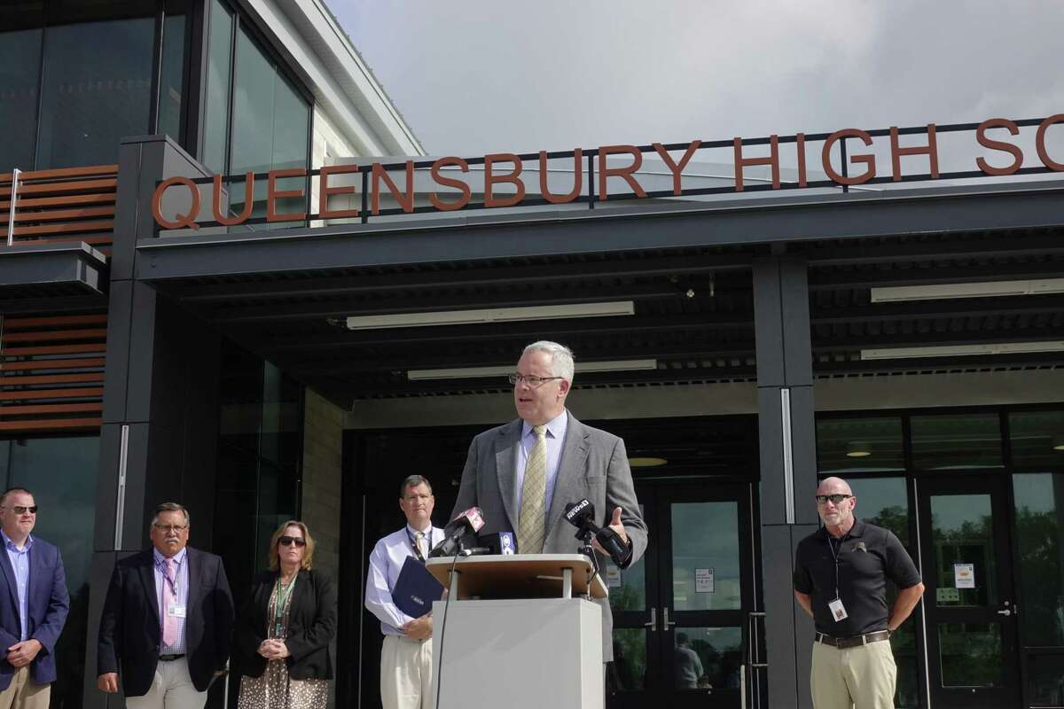 With area school superintendents seen behind him, State Senator Dan Stec speaks at a press conference outside of Queensbury High School on Wednesday, July 21, 2021, in Queensbury, N.Y. The school superintendents along with Senator Stec are asking the governor to release guidance on how schools will be able to operate this fall. (Paul Buckowski/Times Union)