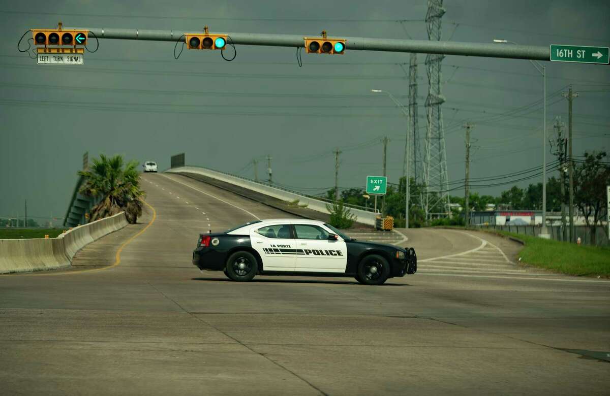 Police block roads in response to a report of a chemical leak at a Dow Chemical plant at 13300 Bay Area Boulevard, Wednesday, July 21, 2021, in La Porte. A shelter-in-place and voluntary evacuation order were both issued in response. A tank wagon over-pressurized, causing a release from the tank's vent, Harris County Pollution Control said in a statement. The incident involved a chemical called Hydroxyethyl Acrylate.