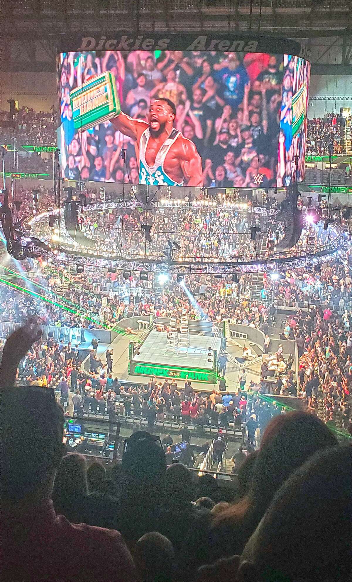 Big E celebrates winning the men's ladder match during WWE's Money in the Bank show on Sunday in Dickies Arena at Fort Worth. 
