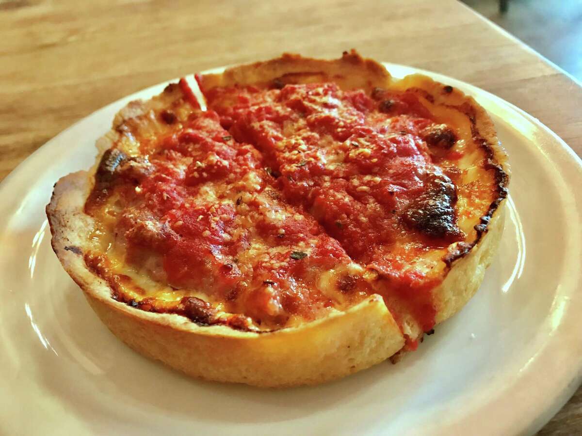 Individual deep dish Chicago Classic pizza with sausage at Lou Malnati’s