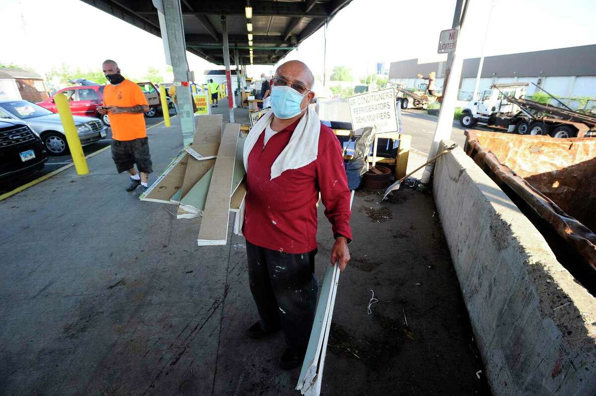 Victor Sanchez of Stamford disposes construction material at the Katrina Mygatt Recycling Center on July 25, 2020 in Stamford, Connecticut.