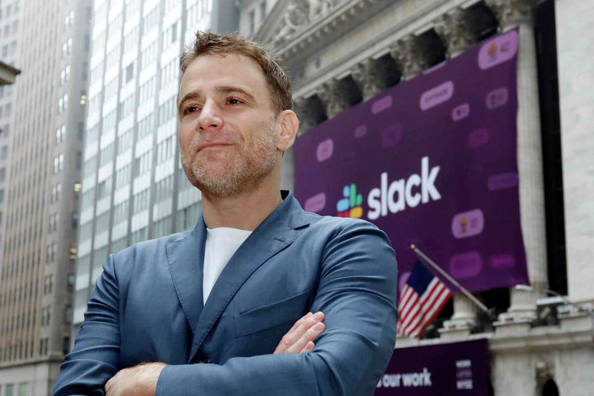 Slack CEO Stewart Butterfield poses for photos outside the New York Stock Exchange before his company's IPO, Thursday, June 20, 2019. Butterfield is leaving the company, now owned by Salesforce, in January.