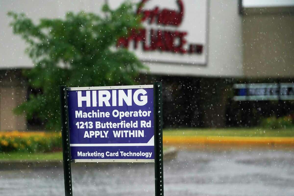 FILE - In this June 24, 2021 file photo, a hiring sign is displayed in Downers Grove, Ill. The number of Americans filing for unemployment benefits rose slightly last week even while the economy and the job market appear to be rebounding from the coronavirus recession with sustained energy. The government said, Thursday, July 8, jobless claims increased by 2,000 from the previous week to 373,000. (AP Photo/Nam Y. Huh)
