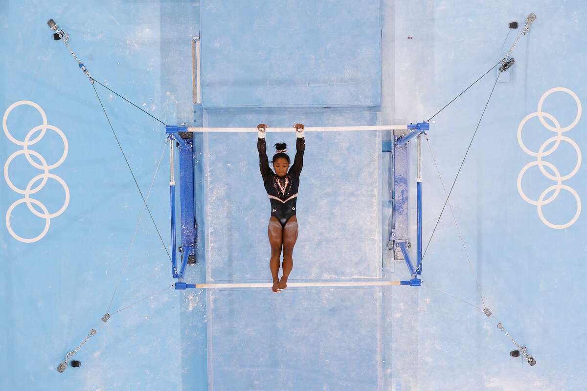 TOKYO, JAPAN - JULY 22: Simone Biles of Team United States trains on uneven bars during Women's Podium Training ahead of the Tokyo 2020 Olympic Games at Ariake Gymnastics Centre on July 22, 2021 in Tokyo, Japan. (Photo by Richard Heathcote/Getty Images)