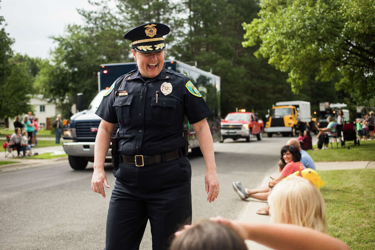Midland Police Chief Nicole Ford greets families during a July event. (Katy Kildee/kkildee@mdn.net)