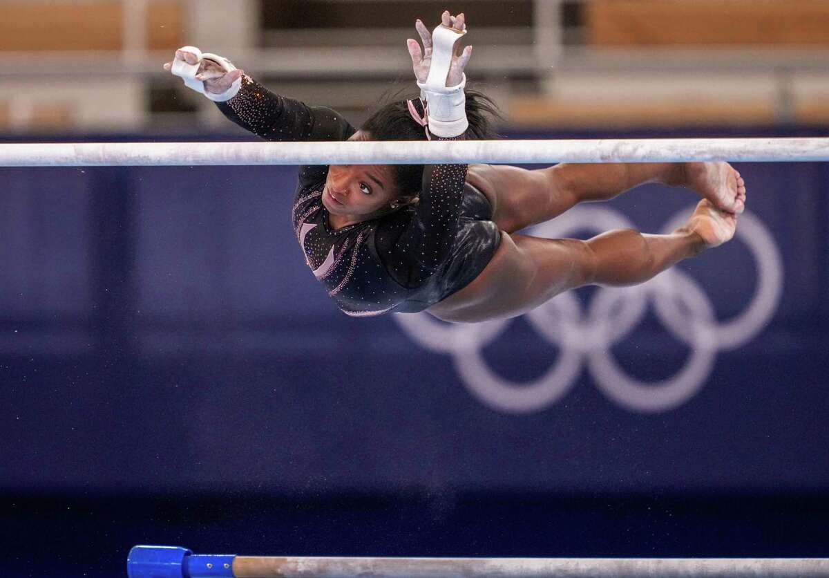 United States Olympic gymnast Simone Biles practices the uneven bars at Ariake Gymnastics Centre in Tokyo on July 22, 2021, ahead of the postponed 2020 Tokyo Olympics. (Chang W. Lee/The New York Times)