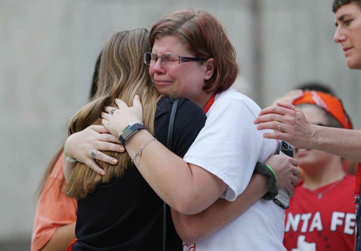 Rhonda Hart, whose daughter, Kimberly, was killed during the Santa Fe school shooting hugs student Esta O'Mara during the Road to Change tour stop at city hall on Sunday, July 8, 2018 in Houston. (Elizabeth Conley/Houston Chronicle)