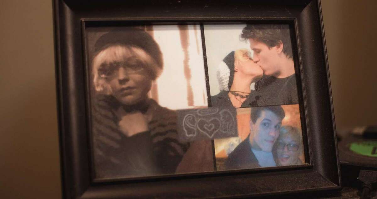 Photos of Joshua Barbeau and Jessica Pereira in a frame in Barbeau's home. 