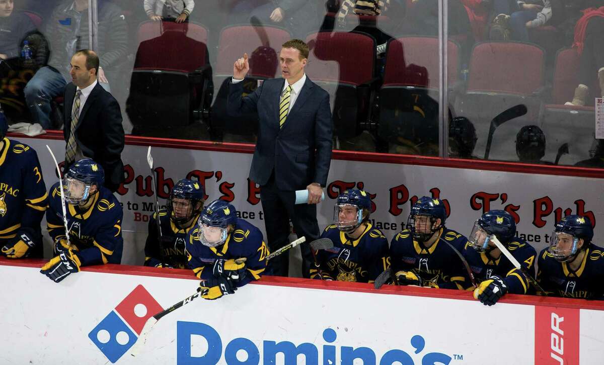 BOSTON, MA - JANUARY 19: Rand Pecknold head coach of the Quinnipiac University Bobcats stands behind the bench during a game against the Boston University Terriers during NCAA men's hockey at Agganis Arena on January 19, 2019 in Boston, Massachusetts. The Bobcats won 4-3 on a goal with 2.5 seconds remaining in regulation. (Photo by Richard T Gagnon/Getty Images)