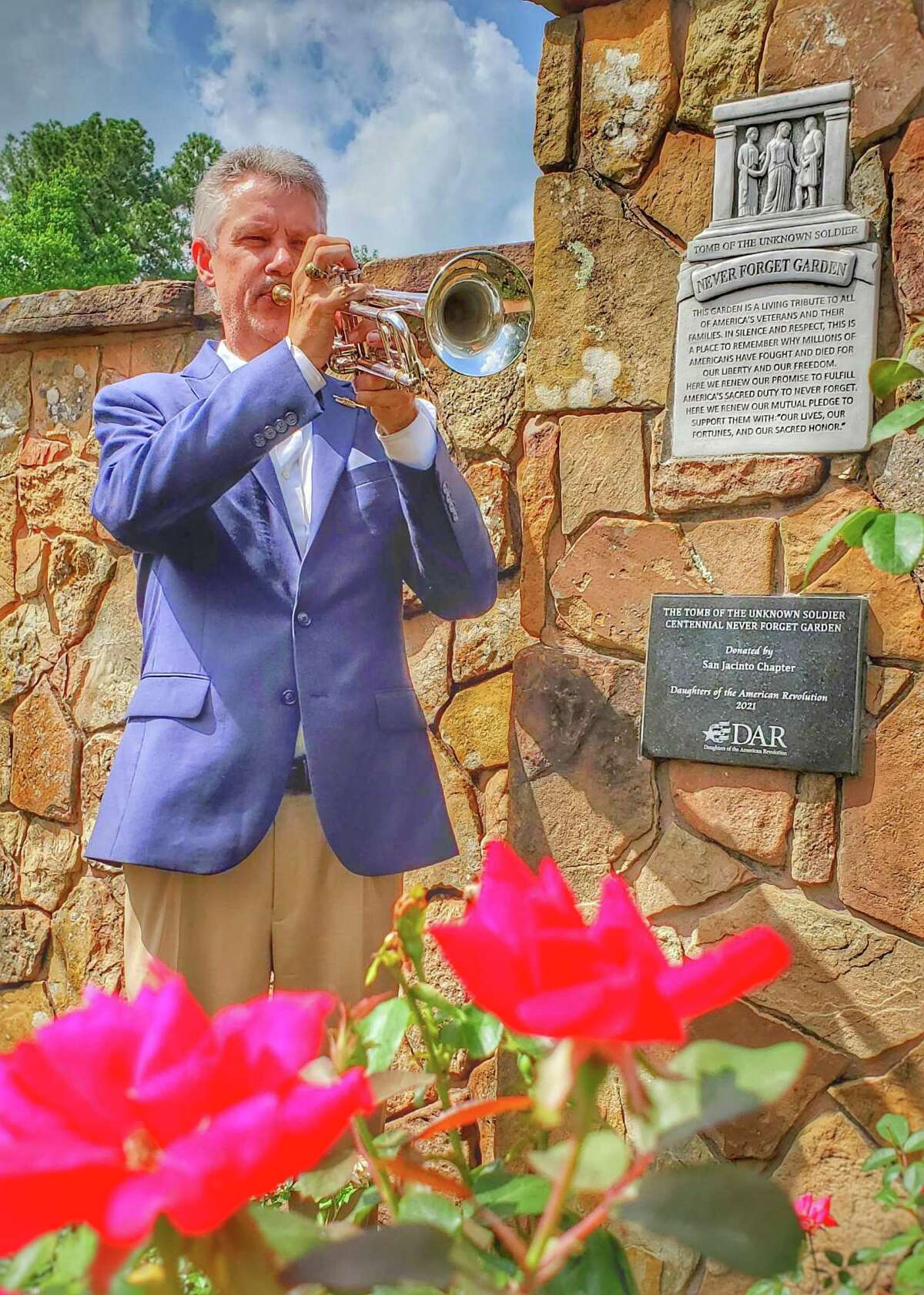 Trumpeter Len Valka closed the Never Forget Garden dedication with a rendition of Taps