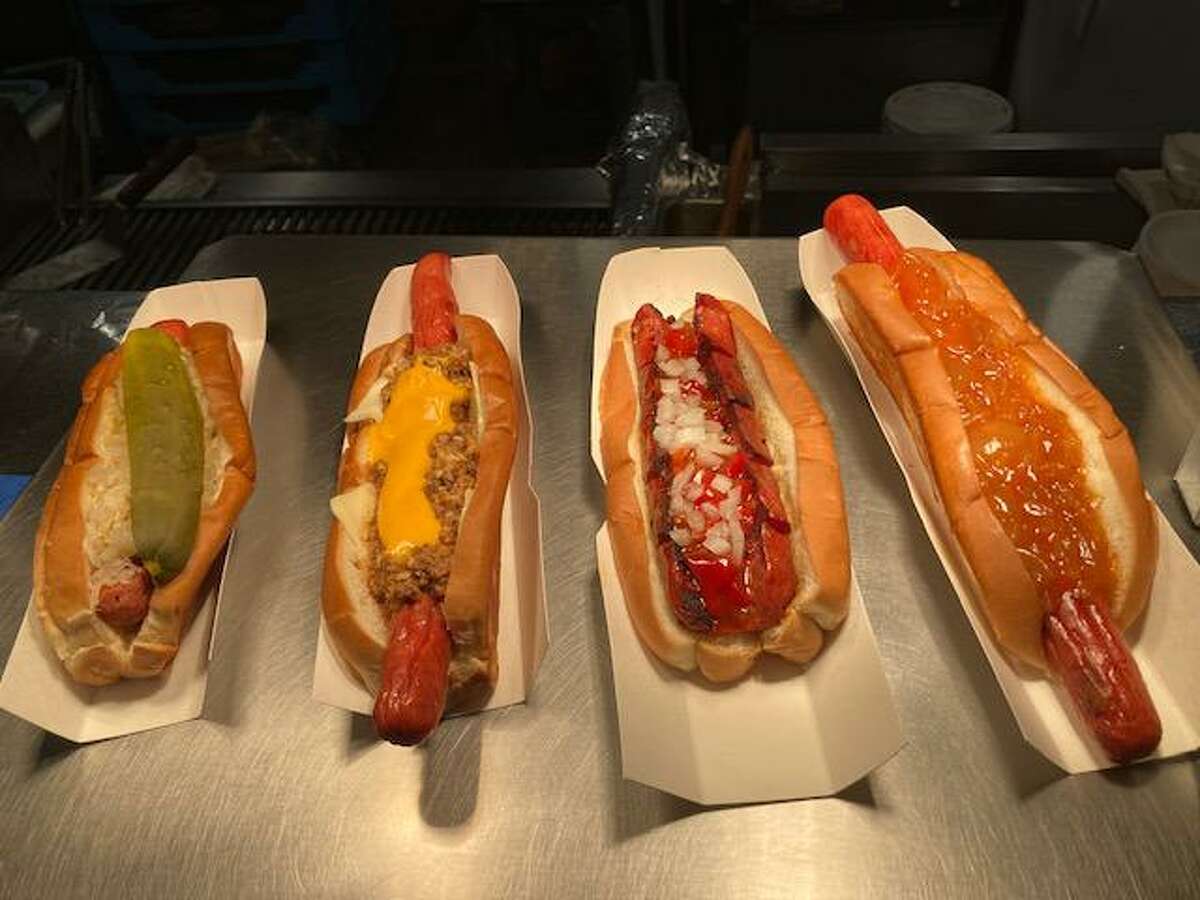 From left, the Famous Hot Dog, the LCD with double cheese, the Red Hot with sweet red pepper relish and onions and the New Yorker 10-inch all beef