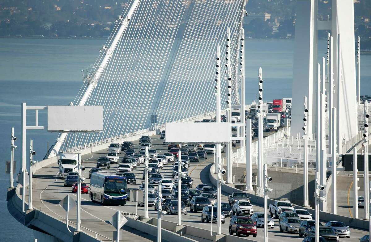 This file photograph shows travelers approaching the Yerba Buena Island tunnel on westbound lanes of the Bay Bridge in San Francisco, Calif. on Friday, Jan. 10, 2020.